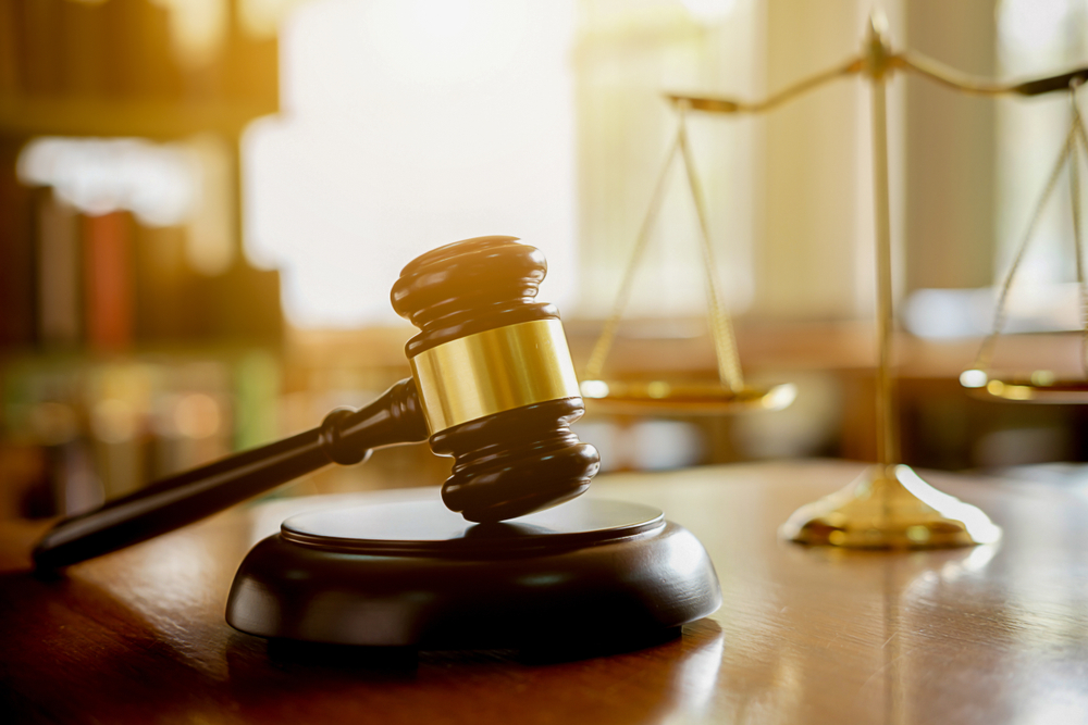judge,gavel,with,justice,lawyers,having,team,meeting,at,law